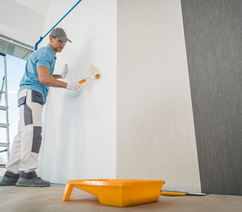 man-painting-a-wall-with-a-roller-2026-03-25-00-55-47-utc