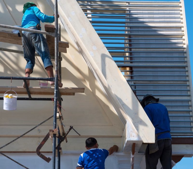 workers-repairing-roof-on-building-under-blue-sky-2026-03-24-06-10-02-utc (Large)